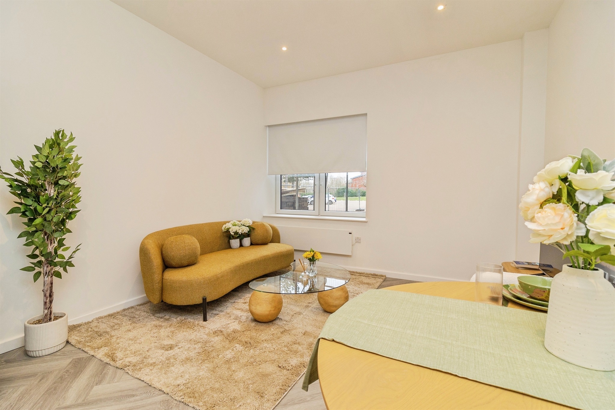 Luxury open-plan dining and living area at Caldecotte Lake apartments in Milton Keynes with contemporary design, premium finishes, natural light, and spacious modern layout.