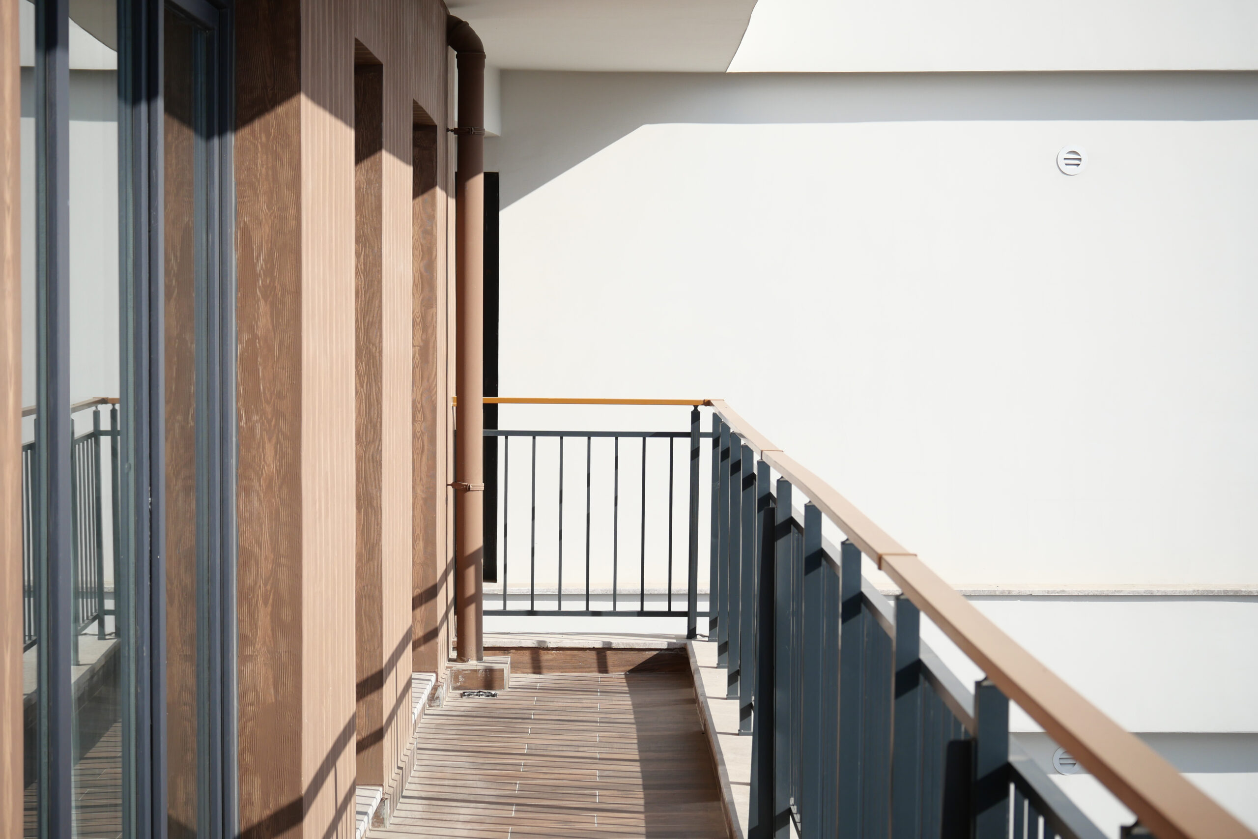 balcony with gray railings and wood paneled wall 2026 03 25 04 46 29 utc scaled